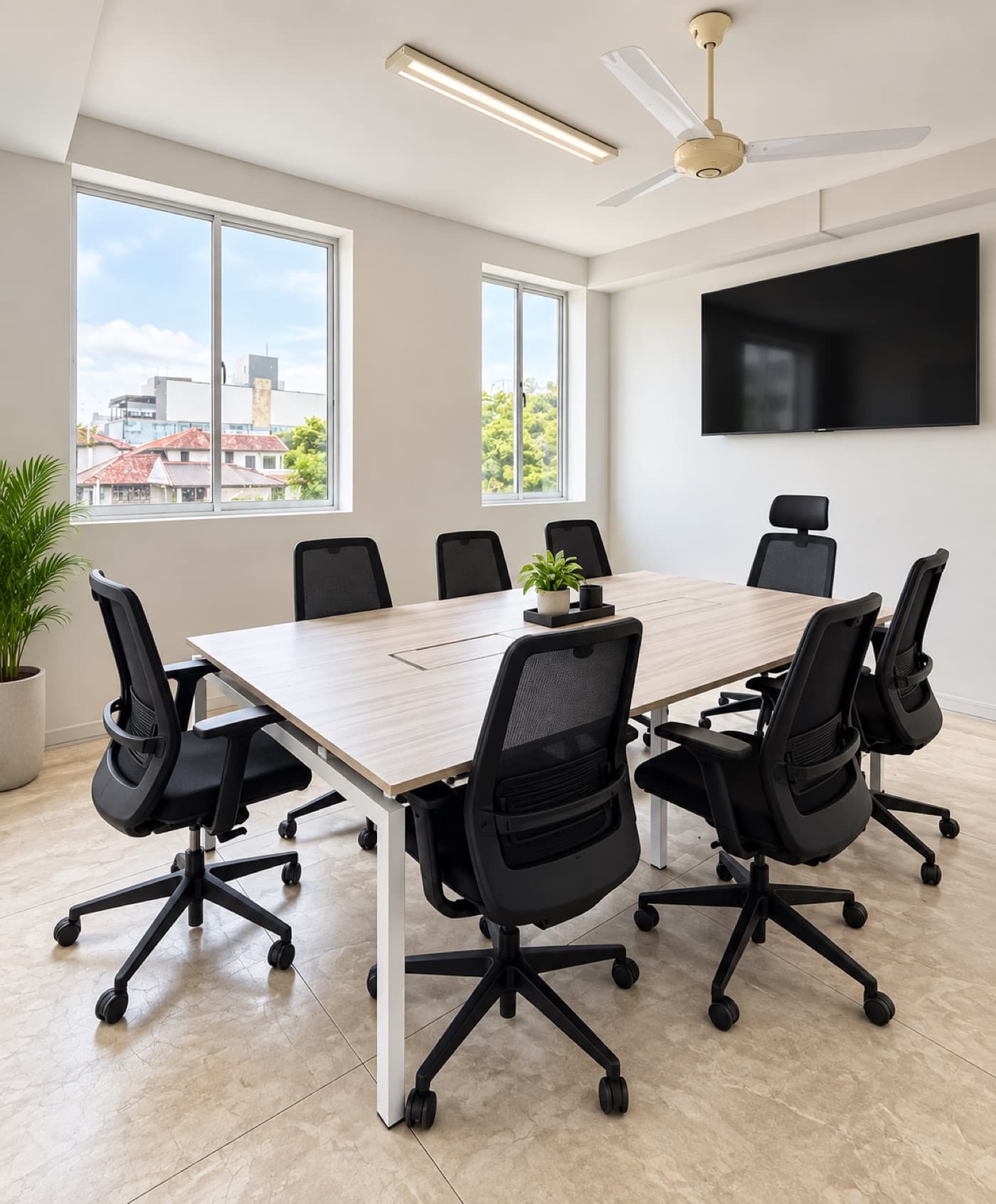 The boardroom with a large table and eight chairs