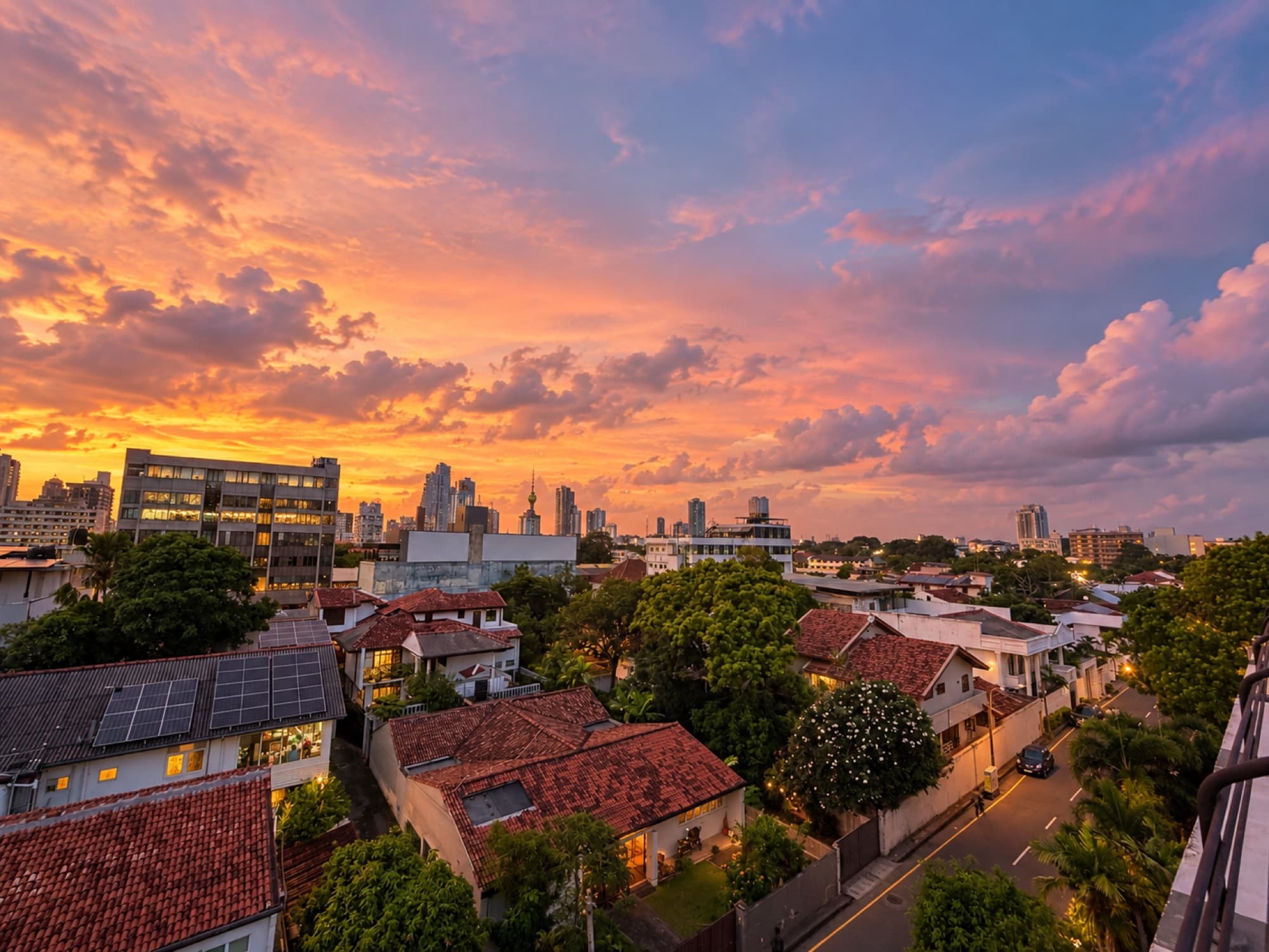 Colombo rooftops and skyline at sunset, seen from the workspace