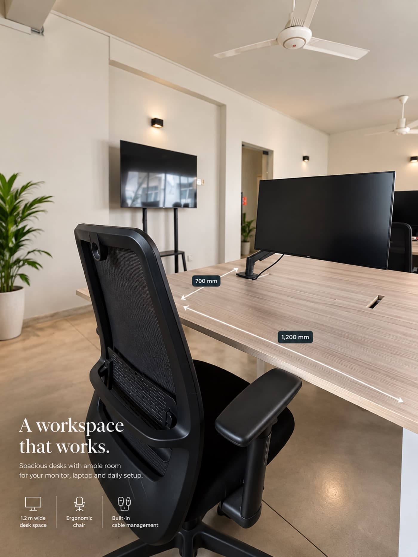A desk with a monitor on an arm